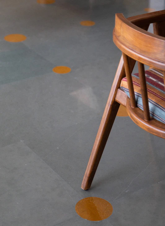 Kota stone flooring with circular Jaisalmer stone inlays and artisanal chair detail