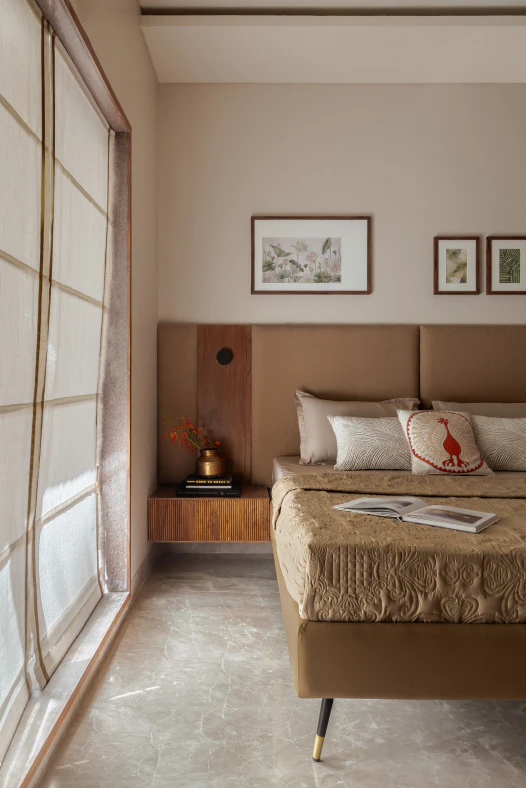 Bedside view featuring floating fluted timber drawer, warm upholstered headboard, and roman window shades